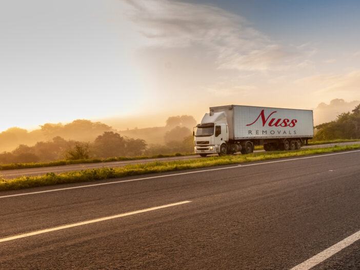Nuss Removals truck driving on the road